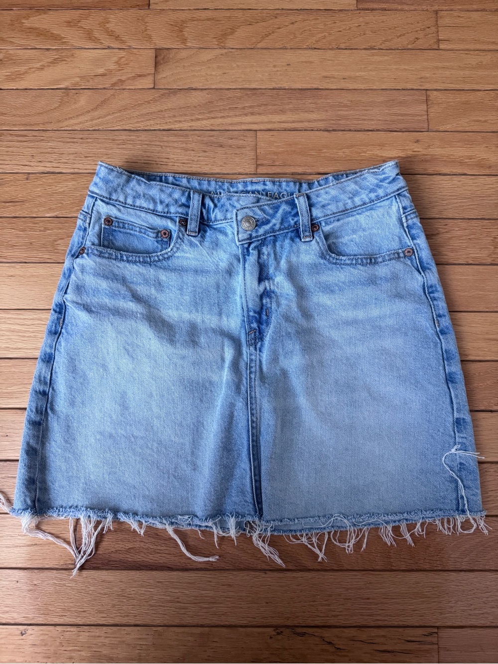 American Eagle Outfitters Light Blue Denim Mini Skirt with Frayed Hem
